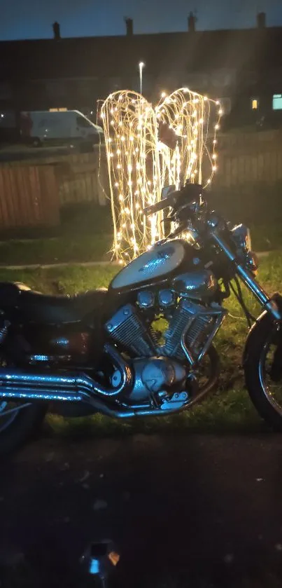 Motorbike glowing under starry night with lights.