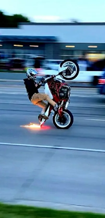 Motorbike performing a wheelie with sparks in an urban street.