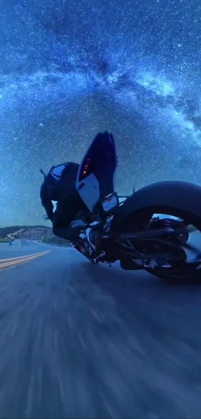 Motorbike racing under a starry night sky.