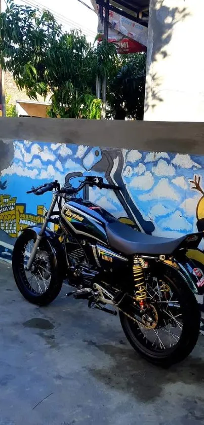 Vintage motorcycle parked by colorful graffiti wall.