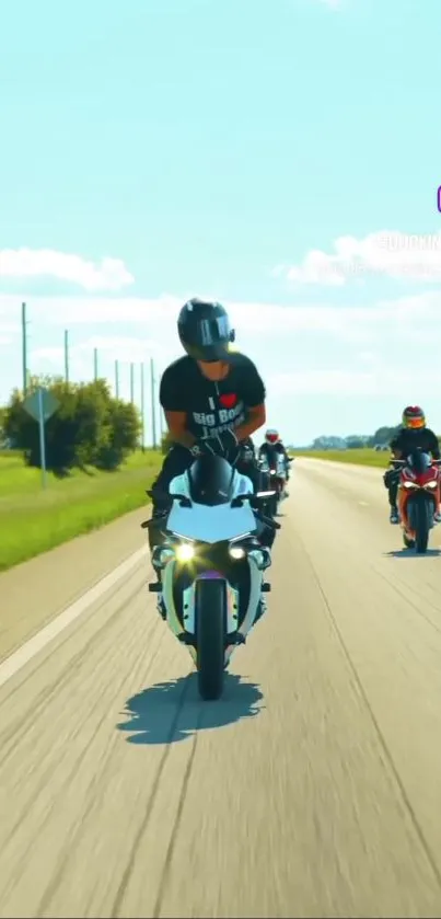 Motorcyclists riding on a sunny highway.