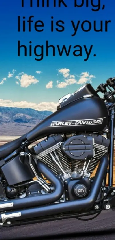 Motorcycle on desert highway with blue sky and inspirational quote.