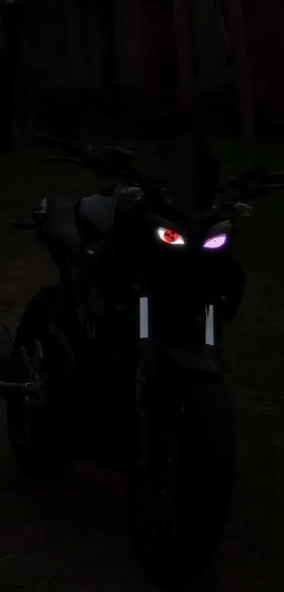 Silhouette of motorcycle with glowing headlights at night.