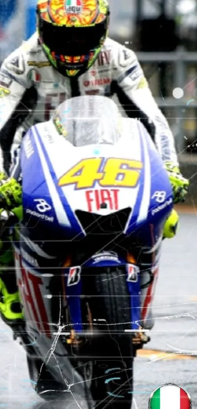 Motorcycle racer in vibrant gear speeding on a rainy track.