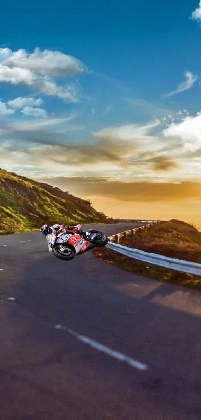 Motorcycle riding on mountain road at sunset with a scenic backdrop.