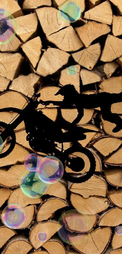 Silhouette of motorcycle stunt on a wood log background.