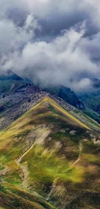 Mountain landscape with clouds and green peaks.