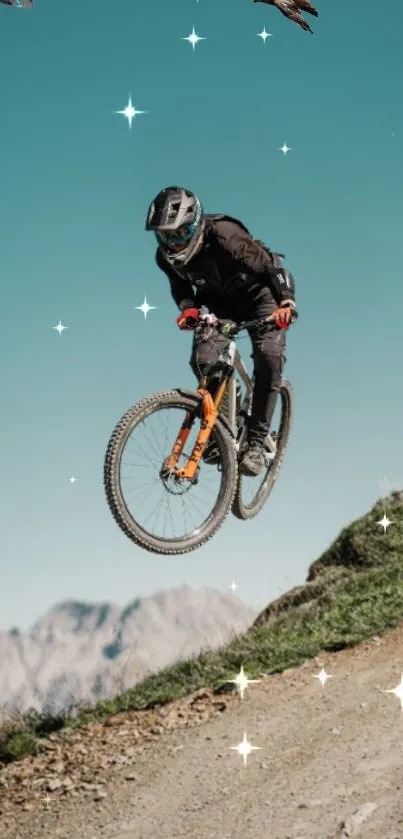 Mountain biker jumps against a scenic blue sky.