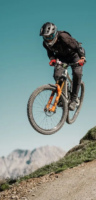 Mountain biker airborne over rugged terrain.