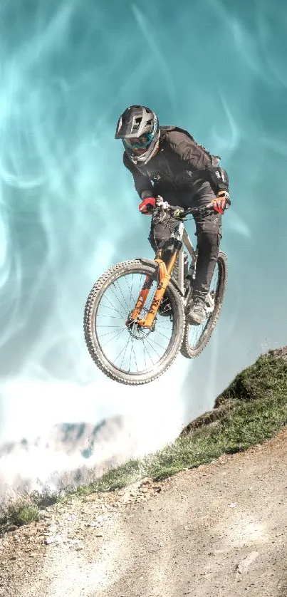 Mountain biker airborne on rocky trail with blue sky background.