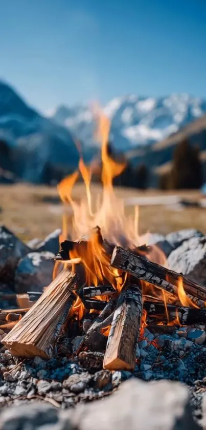 Campfire with mountain landscape backdrop, calm and scenic.