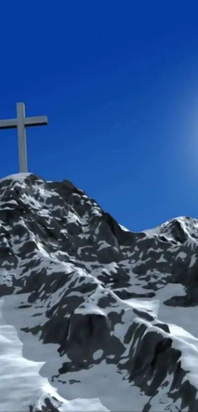 Snowy mountain peak with cross under blue sky and sun.