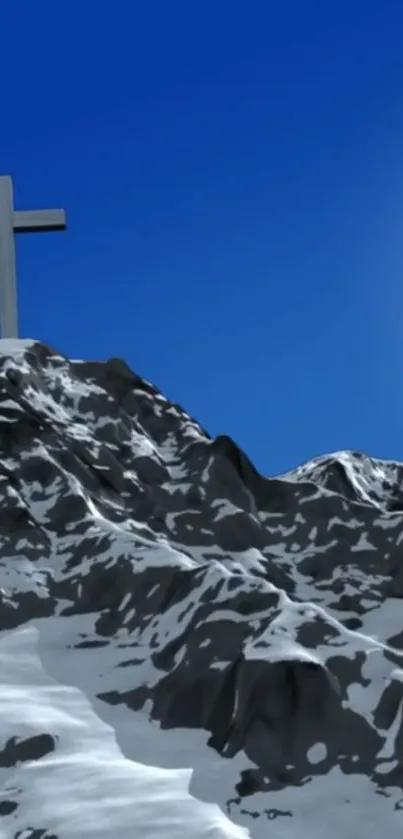 Snowy mountain peak with a prominent cross under a clear blue sky.