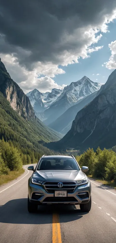 Car driving through mountain range with dramatic sky.