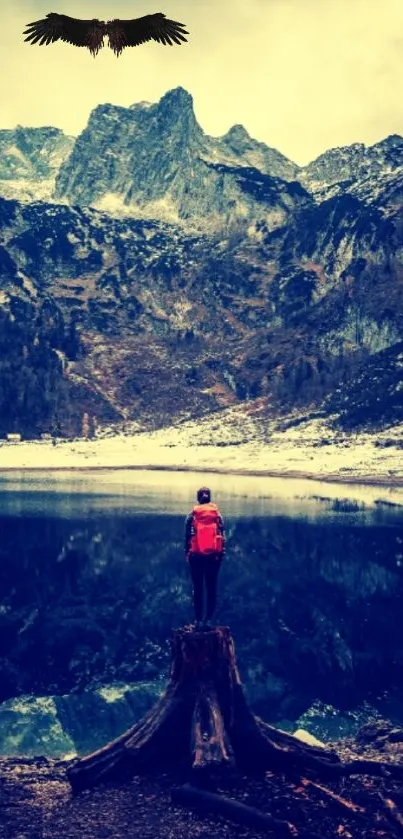 Adventurer by a mountain lake with an eagle overhead.