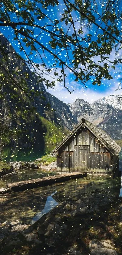 Rustic cabin by mountain lake under blue sky.