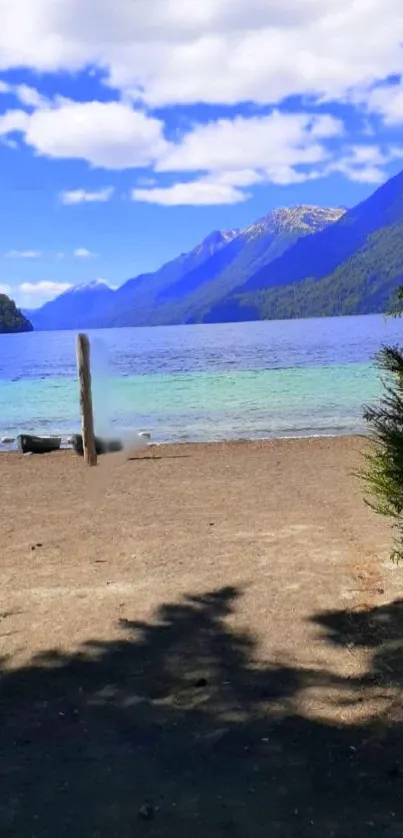 Serene mountain lake with blue sky and lush greenery.