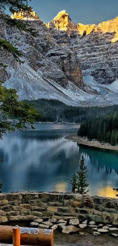 Scenic mountain lake view with golden peaks and calm water at sunrise.