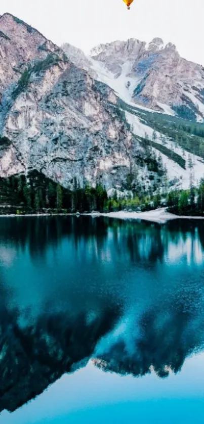 Scenic view of mountain and teal lake with reflections, offering tranquil vibes.