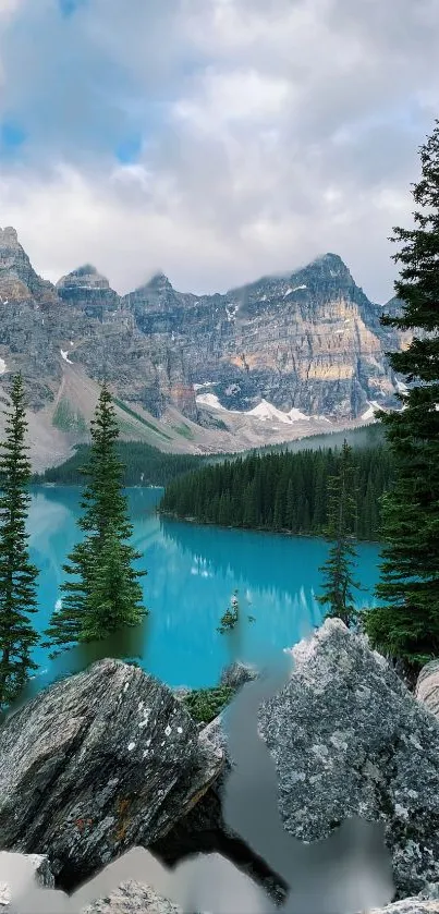 Serene mountain lake with pine trees and turquoise waters.