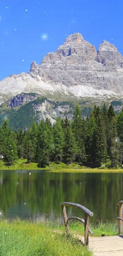 Scenic mountain lake with blue sky and green trees, reflecting tranquility.