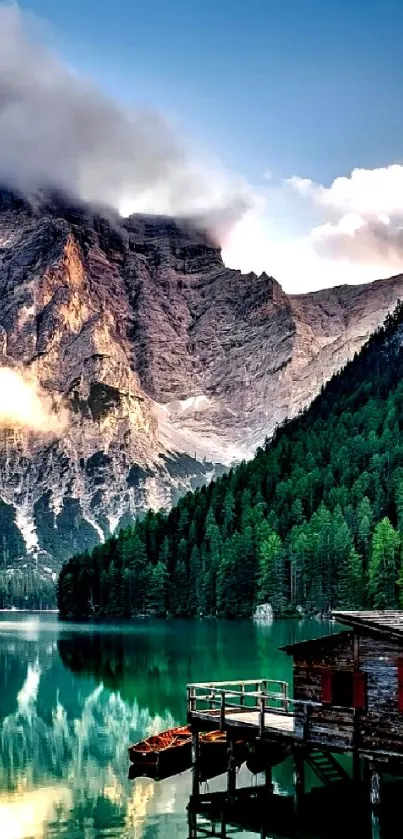 Mountain lake with cabin and forest reflection.