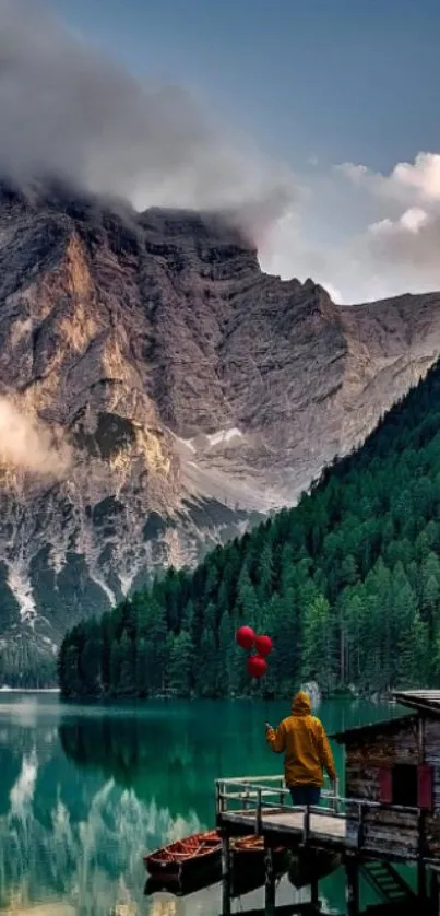 Majestic mountain and lake with red balloons at sunset.