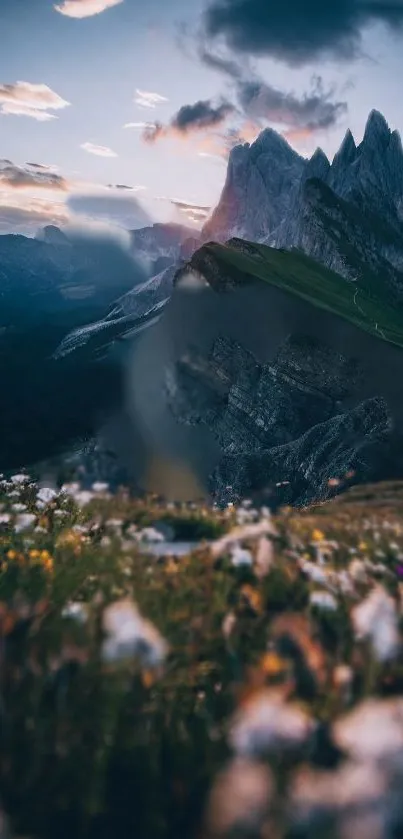 Majestic mountains under a twilight sky with wildflowers in the foreground.