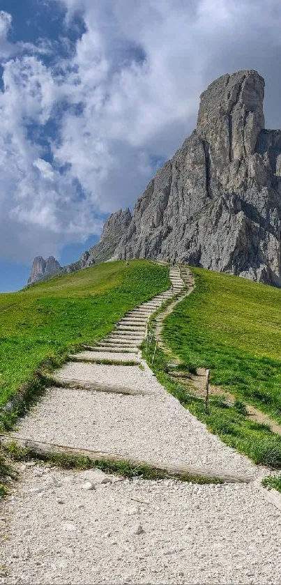 Scenic path leading to a majestic mountain under vibrant sky.