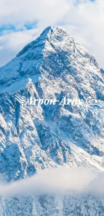 Majestic snowy mountain under a blue sky.