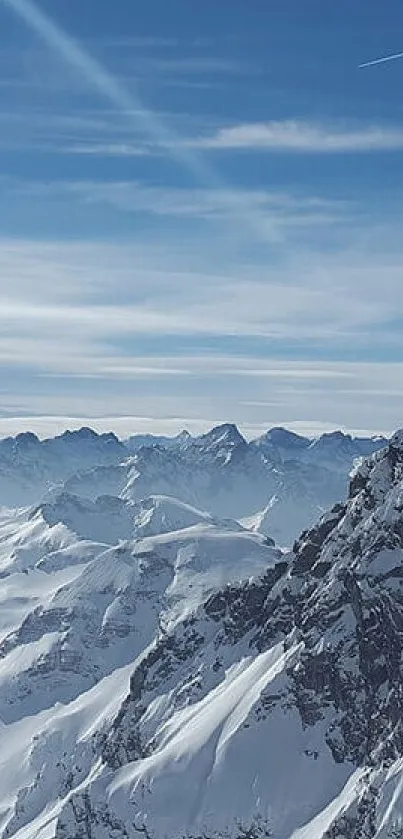 Snowy mountain range under a clear blue sky.