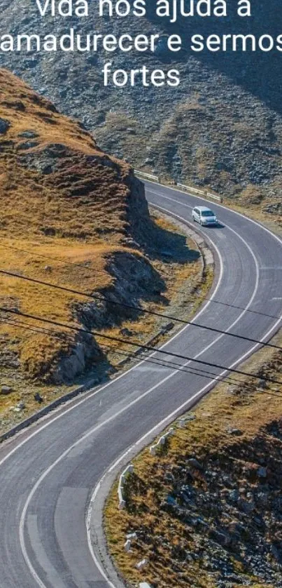 Winding mountain road with inspirational quote.