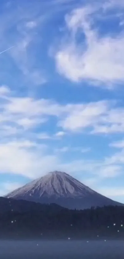 Mountain under blue sky with clouds.