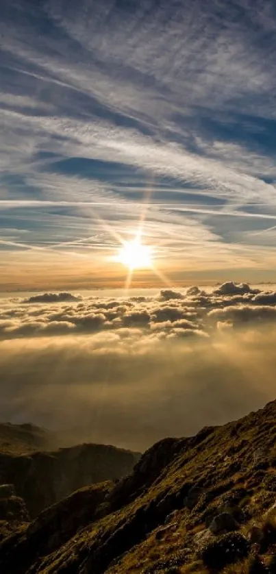 Mountain sunrise view with clouds and sun rays in a tranquil landscape scene.