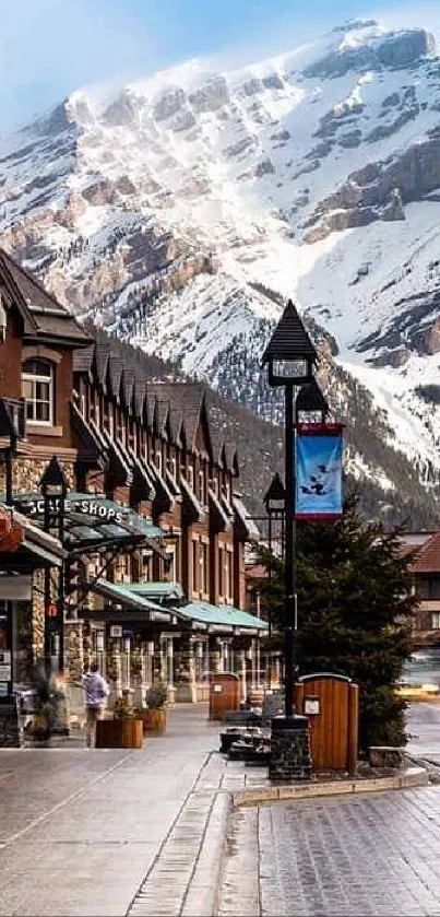 Charming mountain town with street and snow-capped peaks.