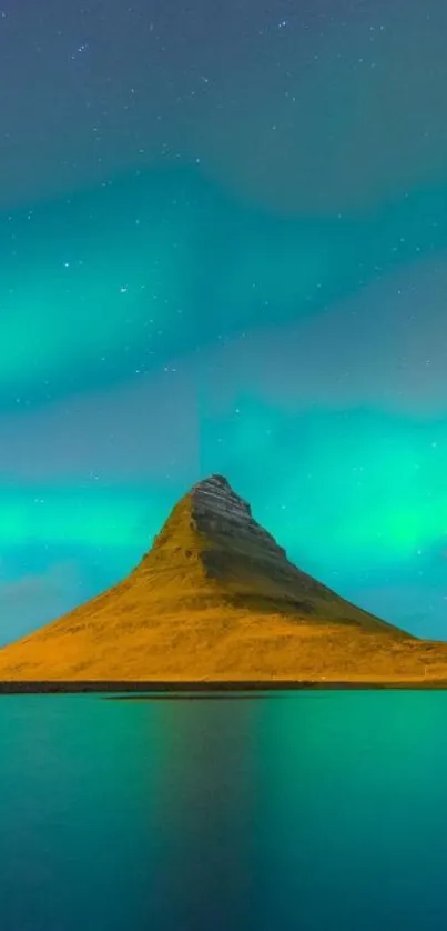 Vibrant aurora borealis over a scenic mountain with reflection.