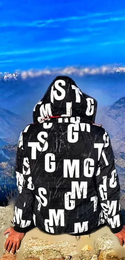 Hooded person with letters overlooking mountain landscape.