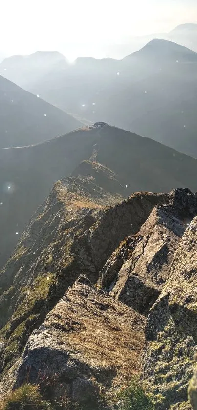 Serene mountain view with sunlit peaks and rugged landscape.