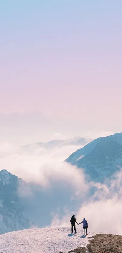 Couple standing on a snowy mountain under a pastel pink and blue sky.