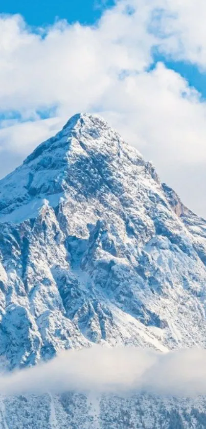 Snowy mountain with emojis under a clear blue sky.