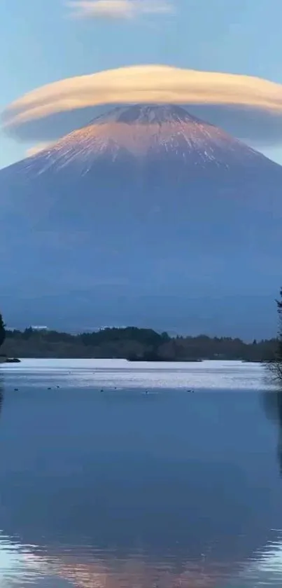 Mt. Fuji with unique cloud cap reflected in a serene lake.