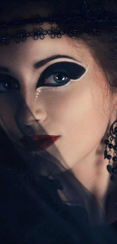 Artistic portrait with dramatic makeup and dark blue theme.