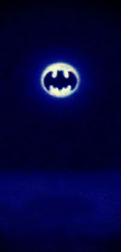 Night sky with Batman signal glowing brightly.