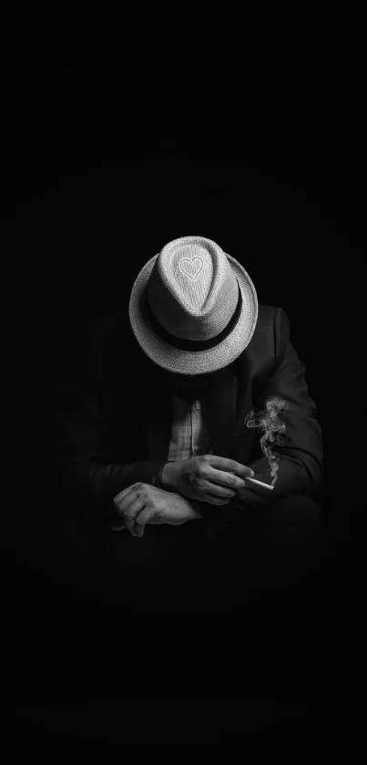 Mysterious figure in hat with cigarette, black and white wallpaper.