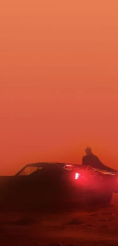 Silhouette of a car in an orange desert.