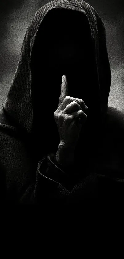 Hooded figure with finger to lips in shadows.