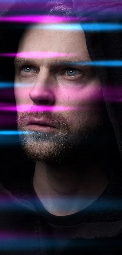 Portrait of a man in a hoodie with a moody dark background.