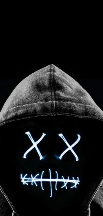 Wallpaper of a hooded figure with neon lights on a black background.