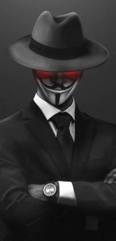 Mysterious masked man in a suit and hat wallpaper with red eye highlights.