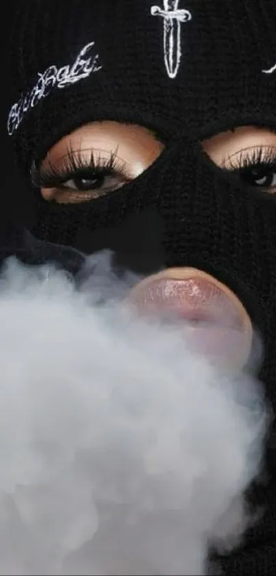 Mysterious person in a mask surrounded by smoke wallpaper.